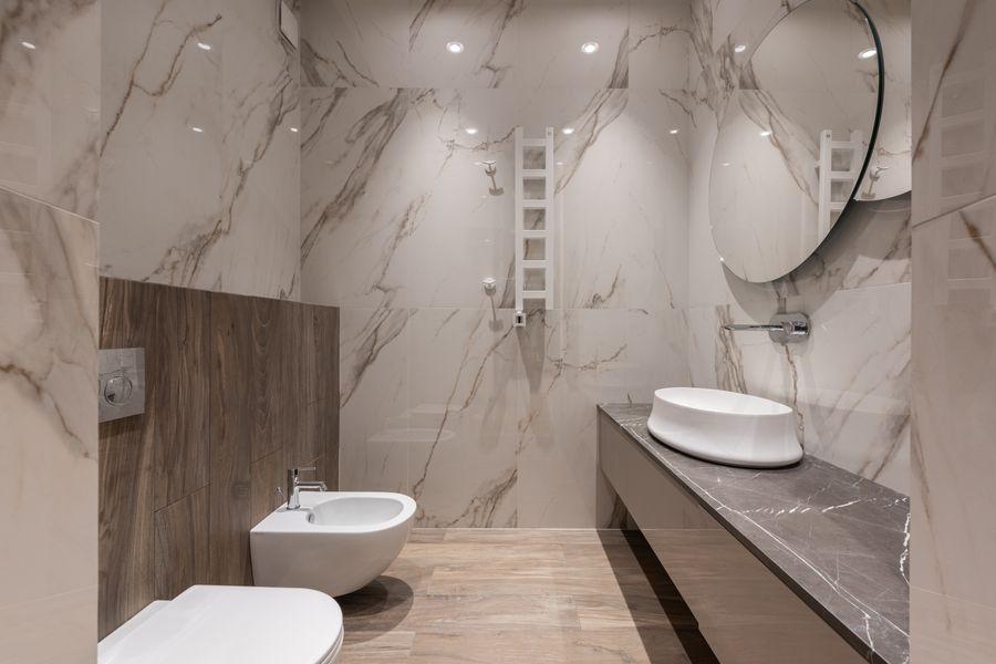 Bathroom with a timber vanity and a pale stone finish